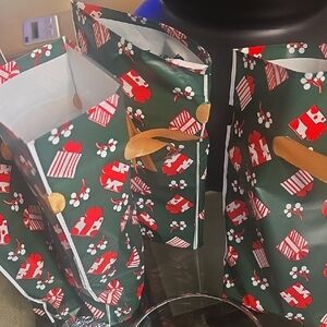 Festive Green Gift Bags with Santa Print Stuffed